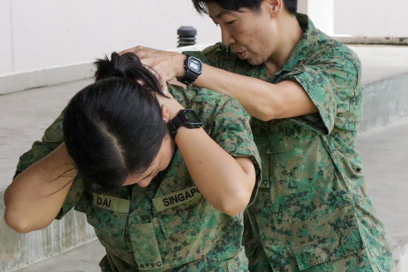 SAFVC Volunteers learning basic arrest techniques during training with an instructor.